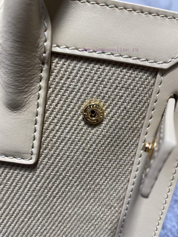 YSL's new Sac de jour organ bag features a brand new contrasting color scheme. The light col onqmb75u - Image 9