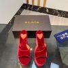 ALAIA's latest hate sky high water table slippers for 2024, with a unique heart-shaped desigbuxoruvy