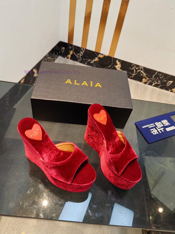 ALAIA's latest hate sky high water table slippers for 2024, with a unique heart-shaped desigbuxoruvy - Image 3