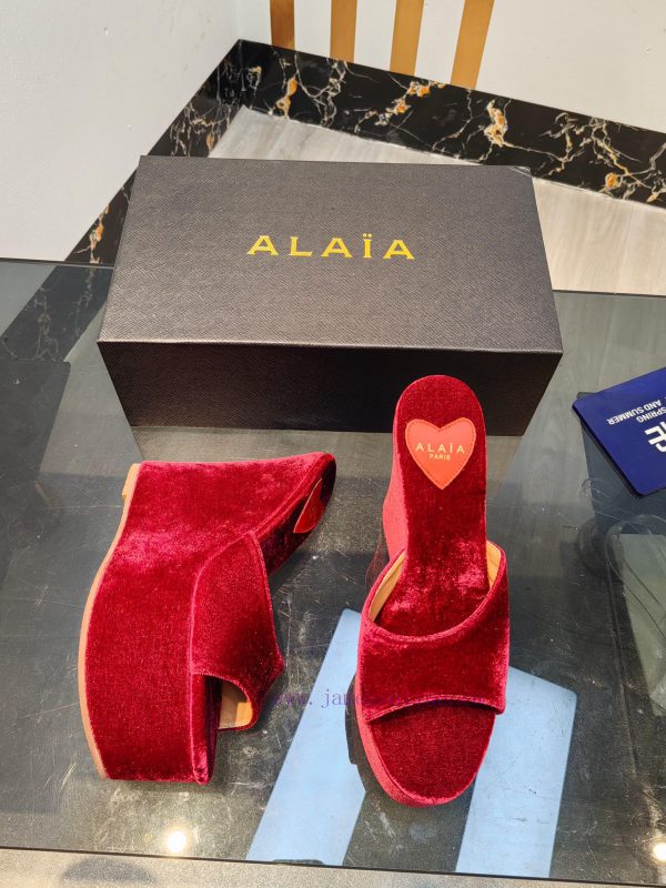 ALAIA's latest hate sky high water table slippers for 2024, with a unique heart-shaped desigbuxoruvy - Image 8
